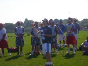 Mat Levine, founder of Citylax, draws the raffle as Connor Wilson(red shorts) and Shannon Sturz looks on